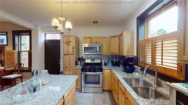 840 13th Ave, Huntington, WV 25701 - kitchen with stainless steel appliances, a sink, a chandelier, decorative backsplash, and crown molding