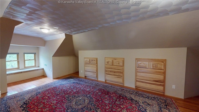 840 13th Ave, Huntington, WV 25701 - additional living space with vaulted ceiling and wood finished floors
