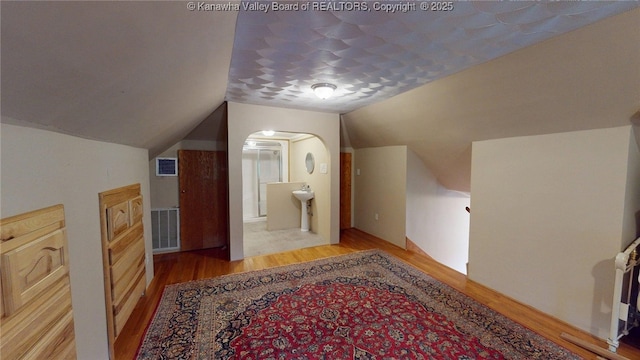 840 13th Ave, Huntington, WV 25701 - bonus room featuring wood finished floors and vaulted ceiling