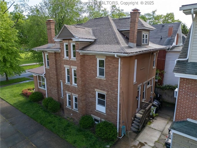 840 13th Ave, Huntington, WV 25701 - view of property exterior with a chimney, roof with shingles, and brick siding