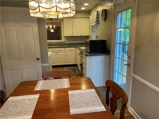 1407 Longridge Rd, Charleston, WV 25314 - dining space with a chandelier and dark wood-style floors