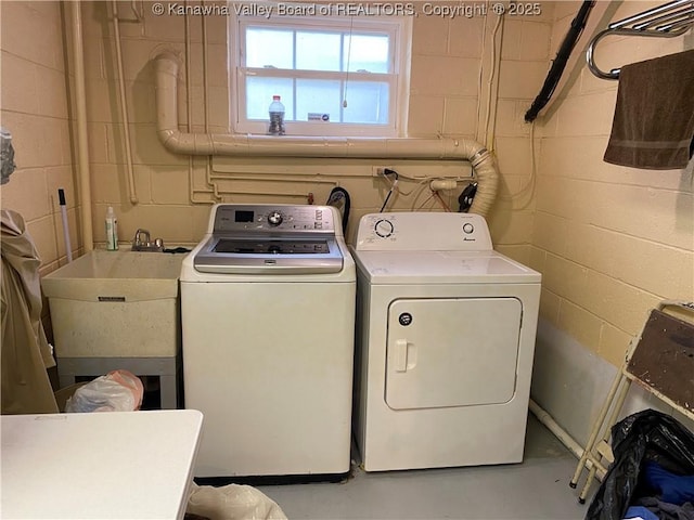 1407 Longridge Rd, Charleston, WV 25314 - clothes washing area featuring washing machine and clothes dryer and concrete block wall