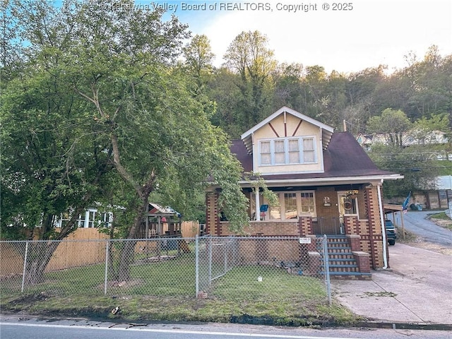 view of front of property featuring a porch and brick siding