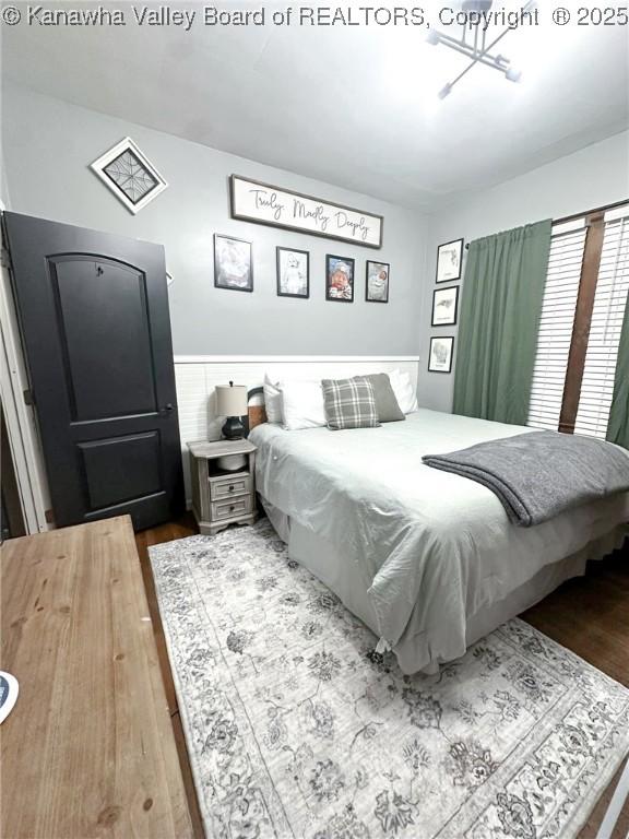 bedroom with wood finished floors