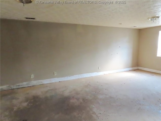 1908 Washington Ave, Saint Albans, WV 25177 - spare room with concrete floors, baseboards, and a textured ceiling