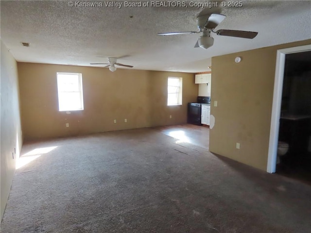 1908 Washington Ave, Saint Albans, WV 25177 - unfurnished living room featuring ceiling fan, carpet flooring, and a textured ceiling