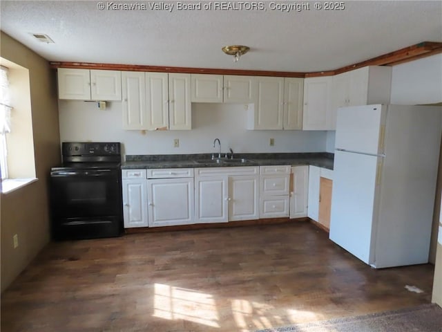 1908 Washington Ave, Saint Albans, WV 25177 - kitchen featuring freestanding refrigerator, black electric range, a sink, dark countertops, and dark wood-type flooring