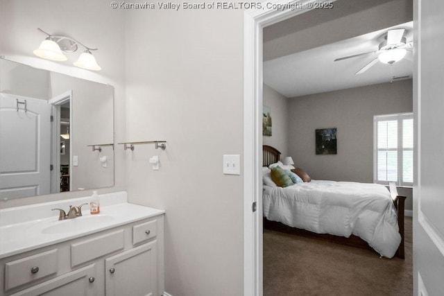 bathroom with a ceiling fan, vanity, and ensuite bathroom