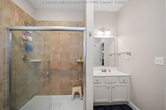 full bath featuring a shower stall and vanity