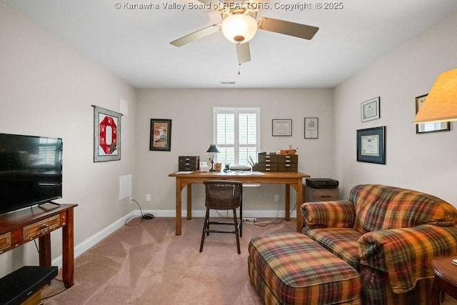 office space with carpet flooring, ceiling fan, and baseboards