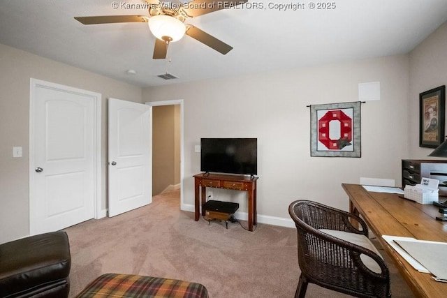 home office with carpet, ceiling fan, and baseboards
