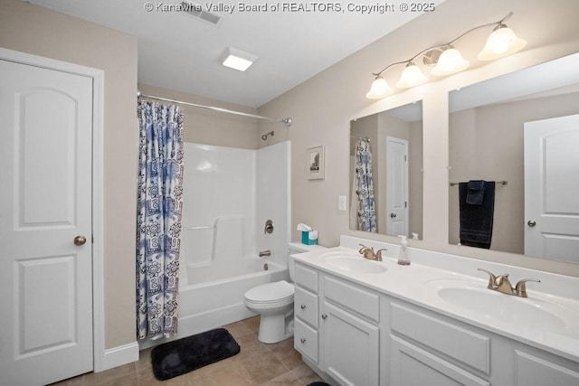 bathroom with double vanity, toilet, tile patterned floors, and shower / bath combo with shower curtain