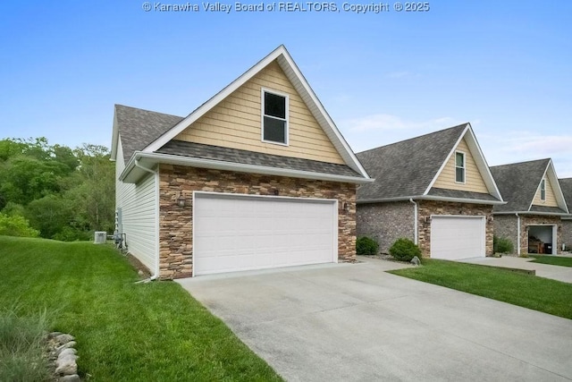 craftsman-style home featuring a front yard, roof with shingles, driveway, and stone siding