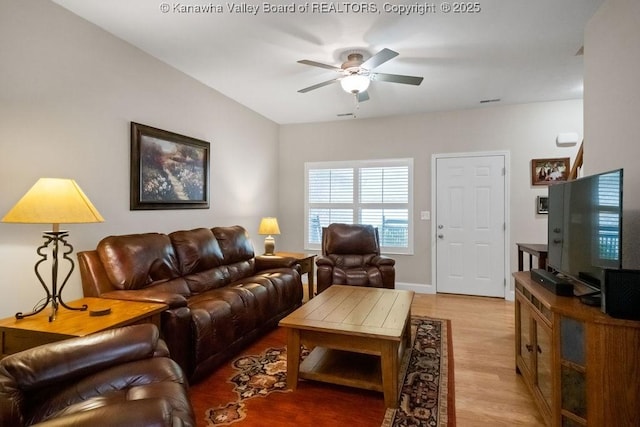 living room with ceiling fan and light wood-type flooring