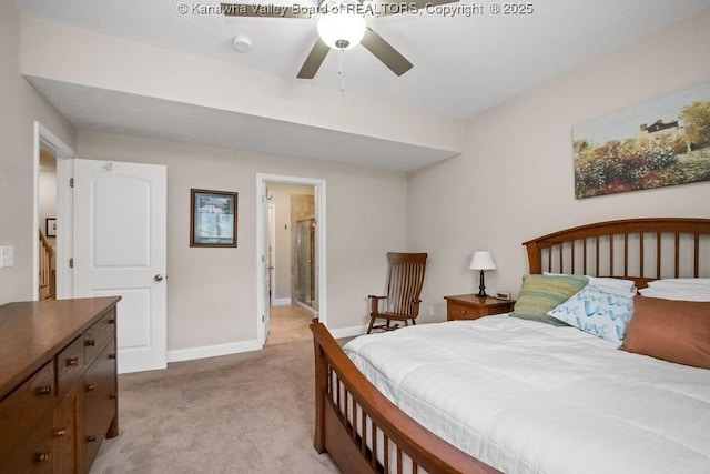 bedroom featuring light carpet and baseboards