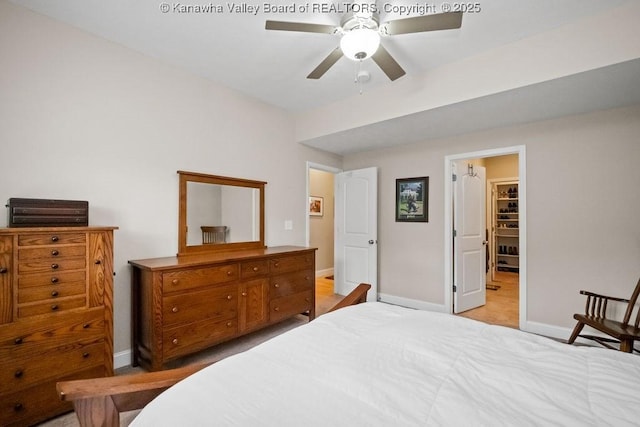 bedroom with baseboards, light colored carpet, and ceiling fan