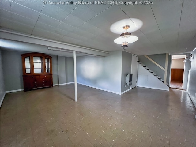 finished below grade area with stairway and baseboards