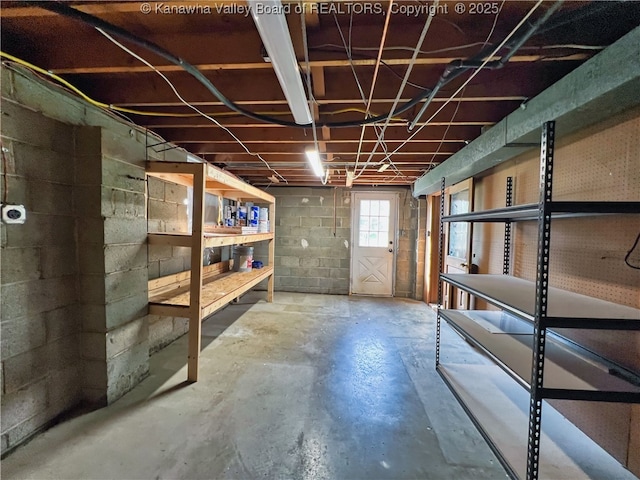 below grade area with concrete block wall