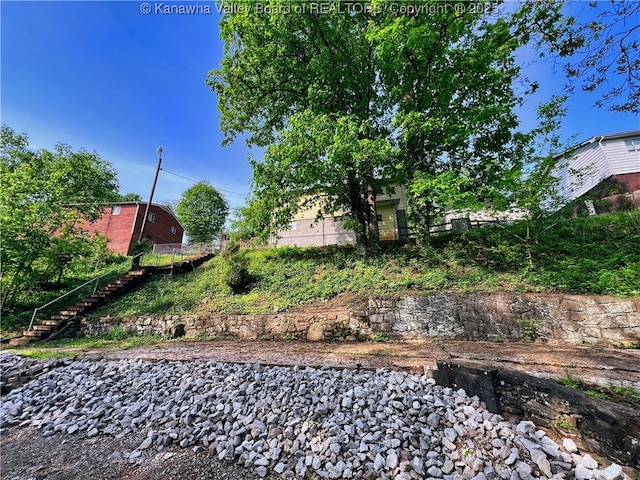 view of yard featuring stairs