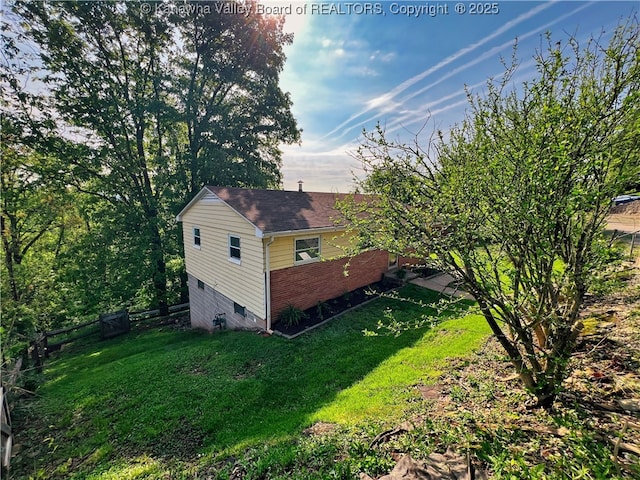 view of home's exterior with brick siding