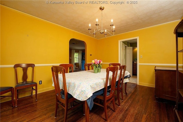 1518 Dogwood Rd, Charleston, WV 25314 - dining room featuring arched walkways, a textured ceiling, a chandelier, wood finished floors, and baseboards