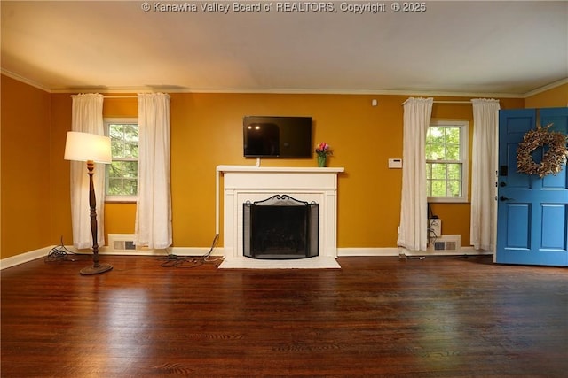 1518 Dogwood Rd, Charleston, WV 25314 - unfurnished living room with wood finished floors, a fireplace with raised hearth, crown molding, and baseboards
