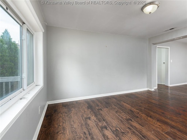 4 Main Ave, Nitro, WV 25143 - unfurnished room featuring wood finished floors, plenty of natural light, and baseboards