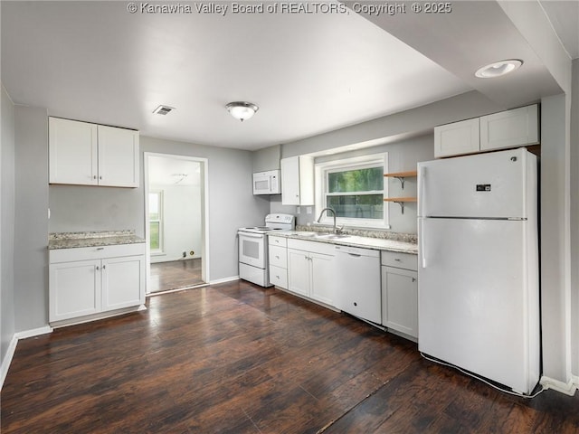 4 Main Ave, Nitro, WV 25143 - kitchen featuring white appliances, a sink, dark wood finished floors, and baseboards