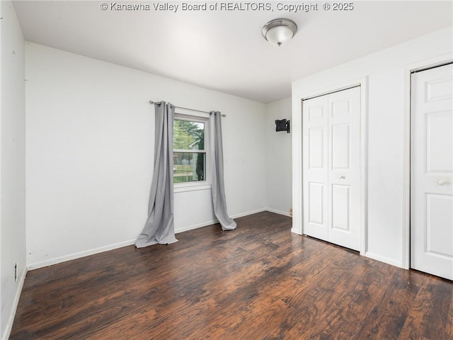 4 Main Ave, Nitro, WV 25143 - unfurnished bedroom featuring wood finished floors and baseboards
