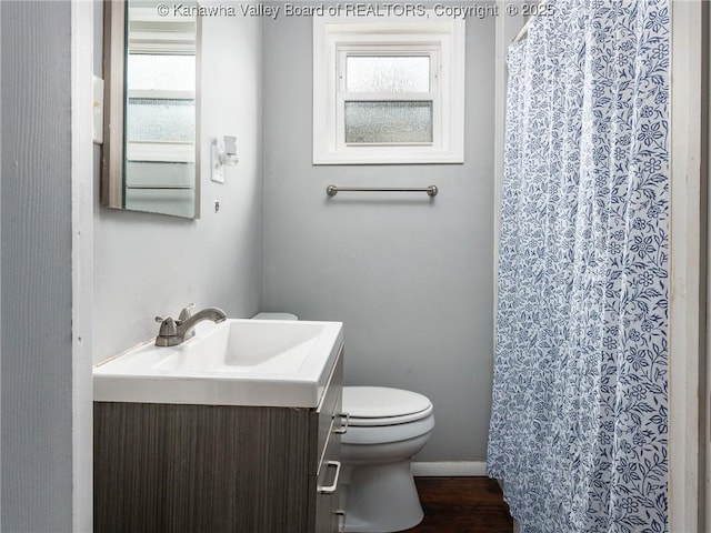 4 Main Ave, Nitro, WV 25143 - bathroom with vanity, toilet, healthy amount of natural light, and curtained shower