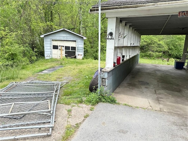 12027 Chap Rd, Wv, WV 25204 - view of yard with a detached garage and an outdoor structure