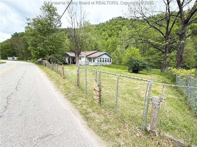 12027 Chap Rd, Wv, WV 25204 - view of asphalt street with a forest view