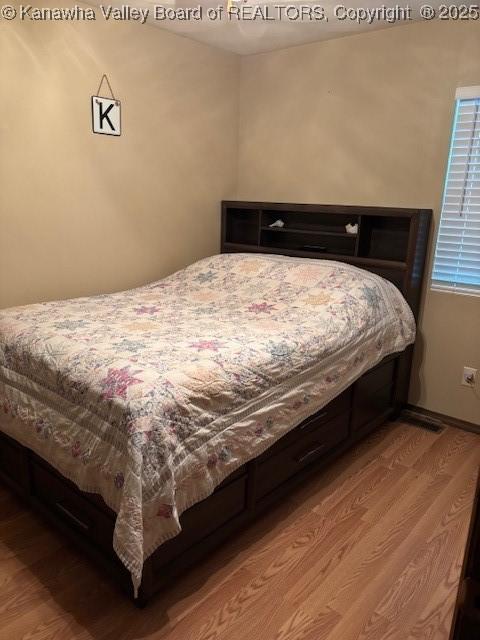 5222 Dalewood Dr, Charleston, WV 25313 - bedroom featuring wood finished floors and baseboards
