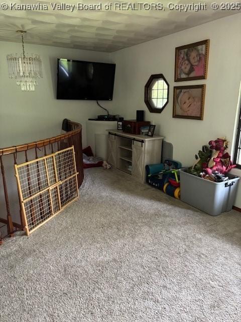5222 Dalewood Dr, Charleston, WV 25313 - living area with carpet and a chandelier