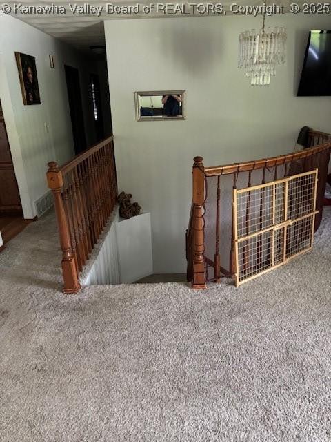 5222 Dalewood Dr, Charleston, WV 25313 - carpeted living area with a chandelier and baseboards