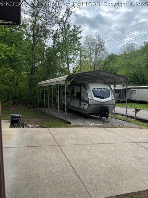 5222 Dalewood Dr, Charleston, WV 25313 - view of car parking featuring driveway and a carport