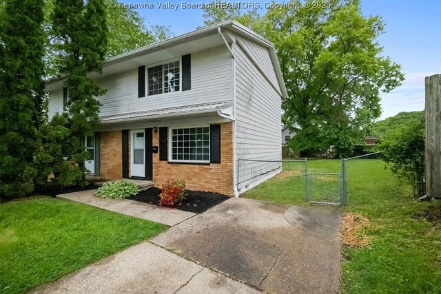 302 Charles Ct, Hurricane, WV 25526 - traditional-style home with a gate and brick siding
