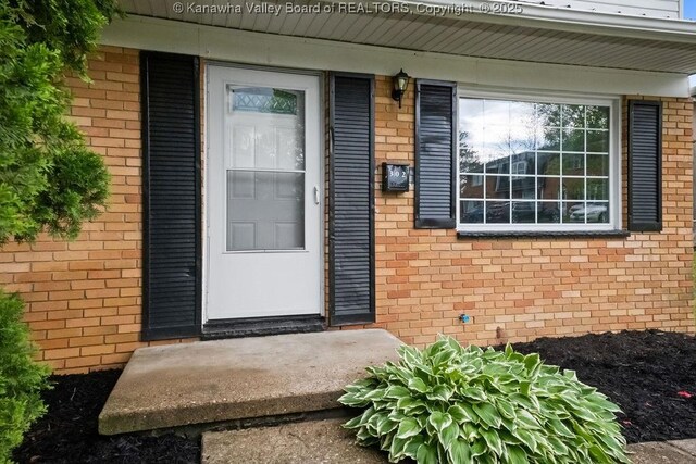 302 Charles Ct, Hurricane, WV 25526 - doorway to property with brick siding