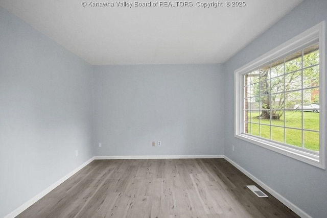 302 Charles Ct, Hurricane, WV 25526 - spare room featuring wood finished floors and baseboards