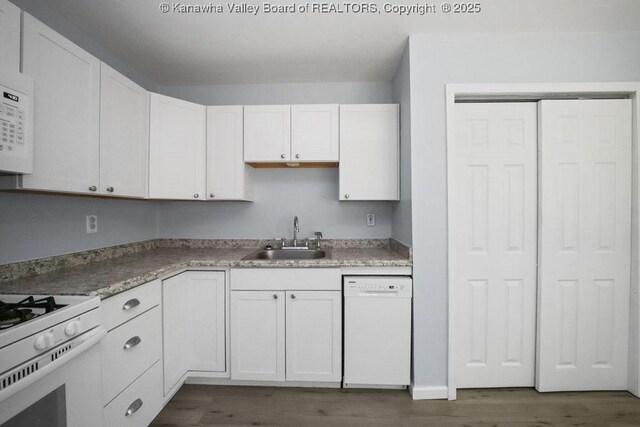 302 Charles Ct, Hurricane, WV 25526 - kitchen with white appliances, a sink, wood finished floors, and white cabinets