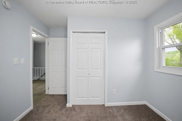302 Charles Ct, Hurricane, WV 25526 - unfurnished bedroom featuring carpet floors, a closet, and baseboards