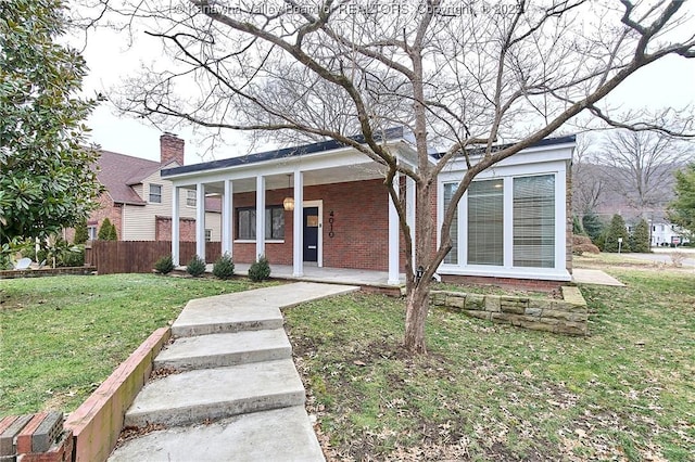 4010 Virginia Ave SE, Charleston, WV 25304 - neoclassical home featuring a porch, brick siding, and a chimney
