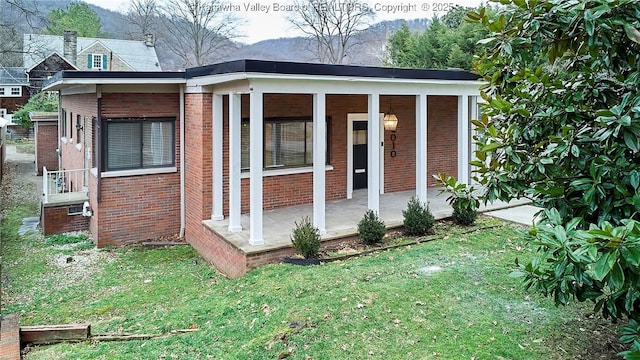 4010 Virginia Ave SE, Charleston, WV 25304 - view of outbuilding with covered porch and a mountain view