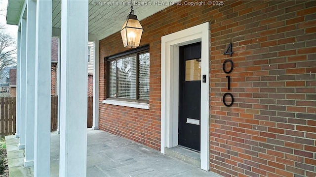 4010 Virginia Ave SE, Charleston, WV 25304 - doorway to property featuring brick siding and a porch