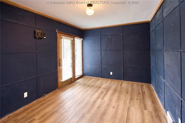 4010 Virginia Ave SE, Charleston, WV 25304 - spare room with light wood-style flooring and ornamental molding