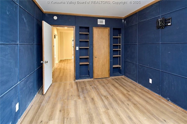4010 Virginia Ave SE, Charleston, WV 25304 - unfurnished bedroom with wood finished floors and crown molding