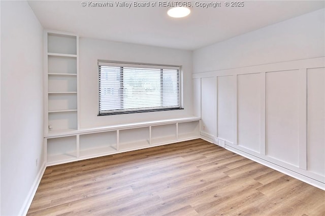 4010 Virginia Ave SE, Charleston, WV 25304 - spare room featuring wood finished floors and a decorative wall