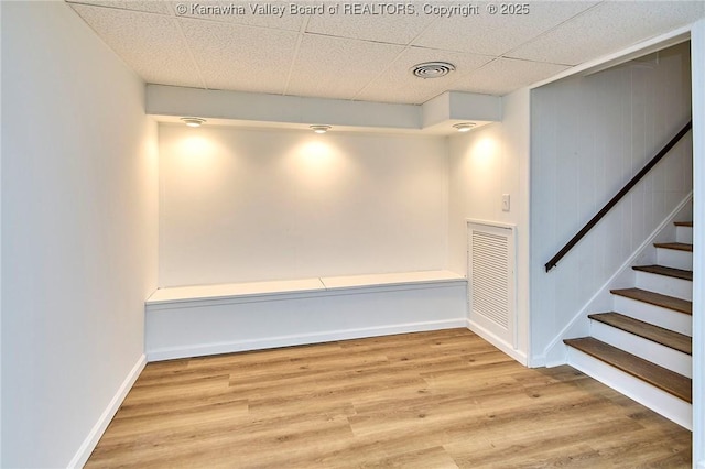 4010 Virginia Ave SE, Charleston, WV 25304 - below grade area with wood finished floors, stairs, baseboards, and a paneled ceiling