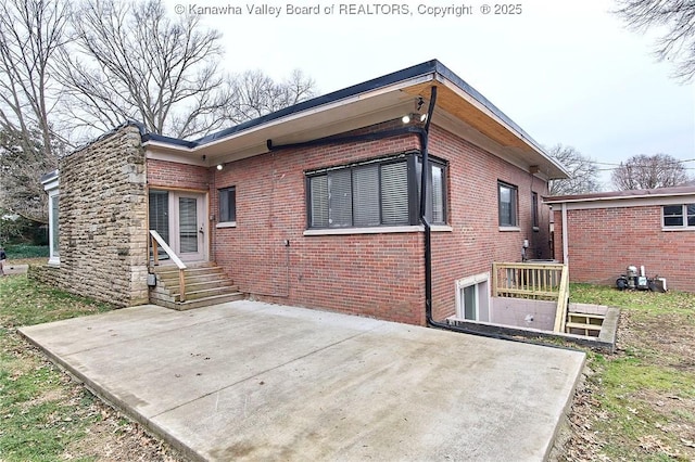4010 Virginia Ave SE, Charleston, WV 25304 - back of house featuring a patio, entry steps, and brick siding