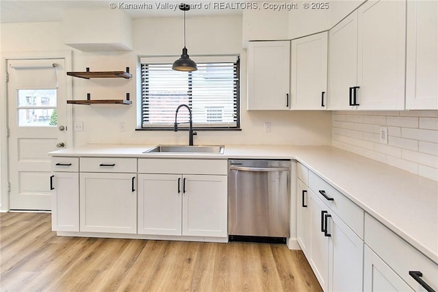 4010 Virginia Ave SE, Charleston, WV 25304 - kitchen featuring dishwasher, a sink, white cabinets, and light wood-style floors
